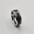 Silver ring on a light gray background