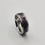 Silver ring on a light gray background