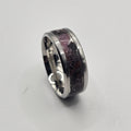 Silver ring on a light gray background