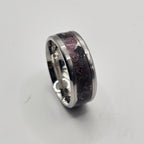 Silver ring on a light gray background