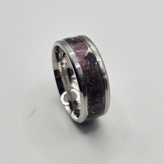 Silver ring on a light gray background